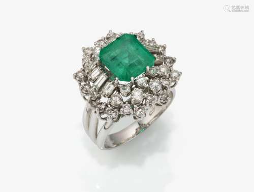 A ring with emerald and diamonds
