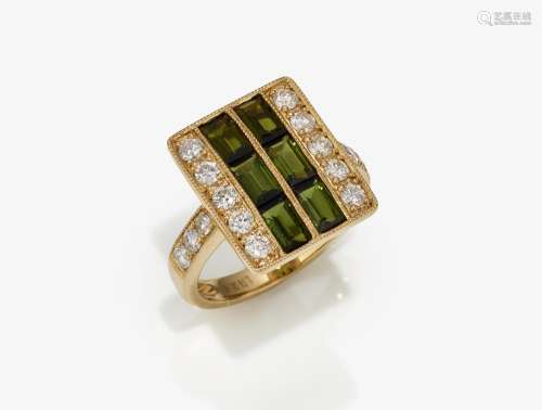 A modern cocktail ring studded with brilliant cut diamonds a...