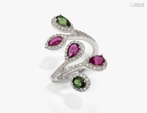 An entourage decorated cocktail ring studded with tourmaline...