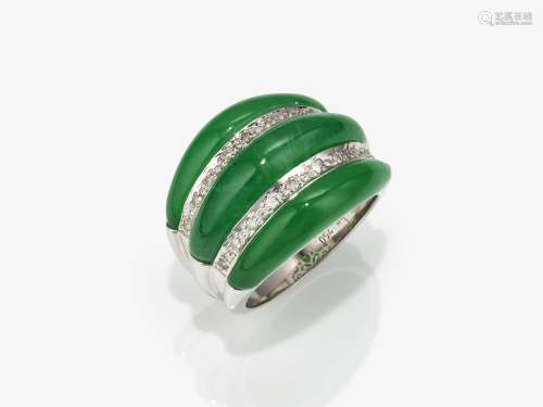 A modern cocktail ring decorated with apple green jade and b...