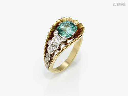 A ring with a blue-green tourmaline and diamonds
