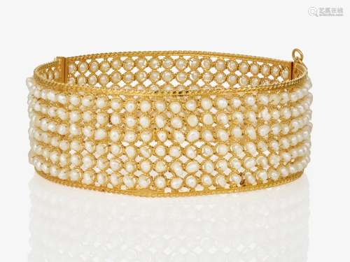 A bangle with small pearls