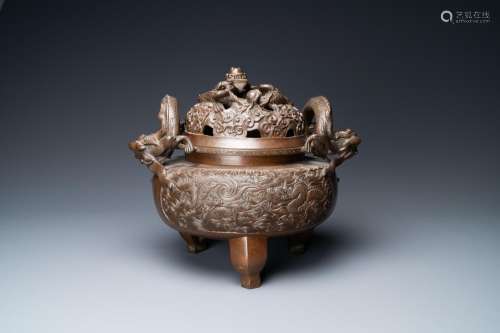 Lot 860: A LARGE CHINESE DRAGON-HANDLED BRONZE TRIPOD CENSER...