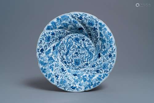 Lot 890: A CHINESE BLUE AND WHITE GADROONED DISH WITH PHOENI...