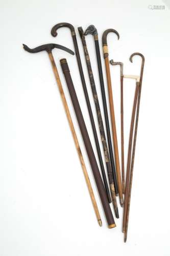 Nine walking sticks in various materials. 19th c
