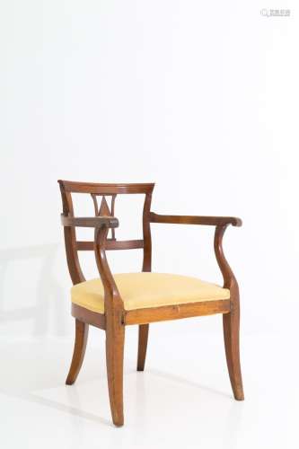 Walnut armchair with brass details