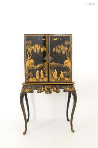 Black lacquered wood cabinet with gold decorations