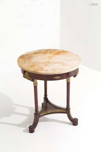 Round wooden table with marble top. Empire period