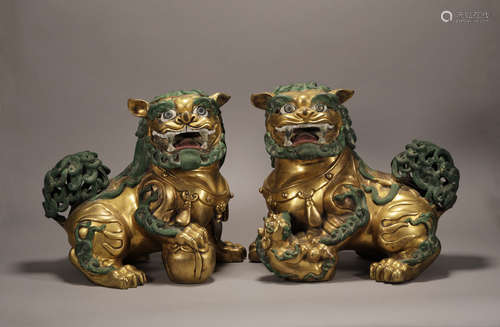 A Pair of Copper and Golden Colored Lion Statue from Ming