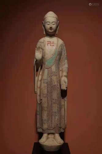 The Buddha statue of the Northern Qi dynasty covered with wh...