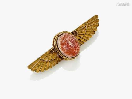 A brooch with an antique carnelian scarab