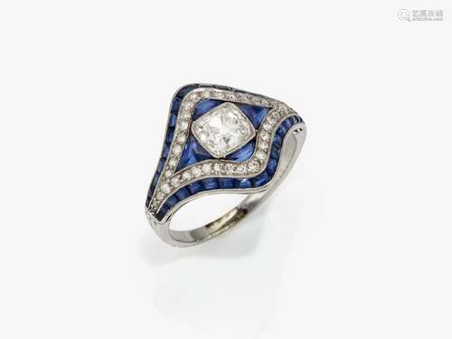 A ring with a Peruzzi cut diamond and sapphires