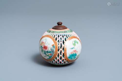 Lot 1052: A CHINESE RETICULATED FAMILLE ROSE POMANDER, YONGZ...