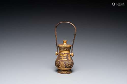 Lot 1078: A CHINESE GOLD-LEAF-DECORATED CAST IRON VASE AND C...