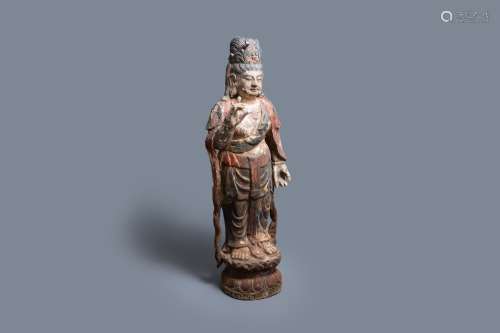 Lot 1079: A LARGE CHINESE POLYCHROMED WOODEN FIGURE OF GUANY...