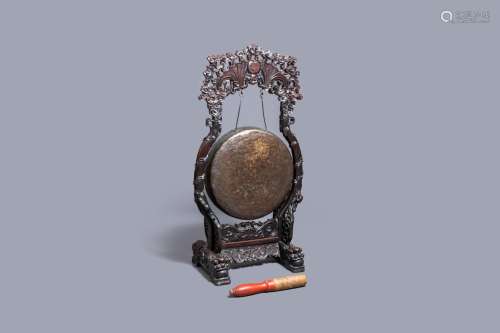 Lot 1091: A CHINESE BRONZE GONG SET IN A CARVED WOODEN STAND...