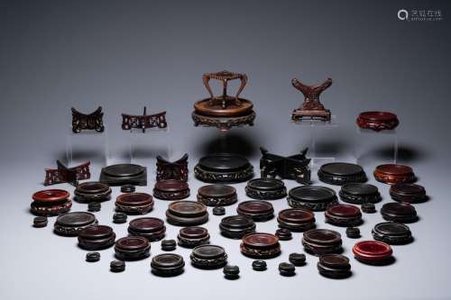Lot 1093: A VARIED COLLECTION OF CHINESE WOODEN STANDS, 19/2...