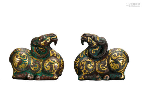 A PAIR OF BRONZE SHEEP INLAID WITH GOLD AND SILVER, THE WARR...