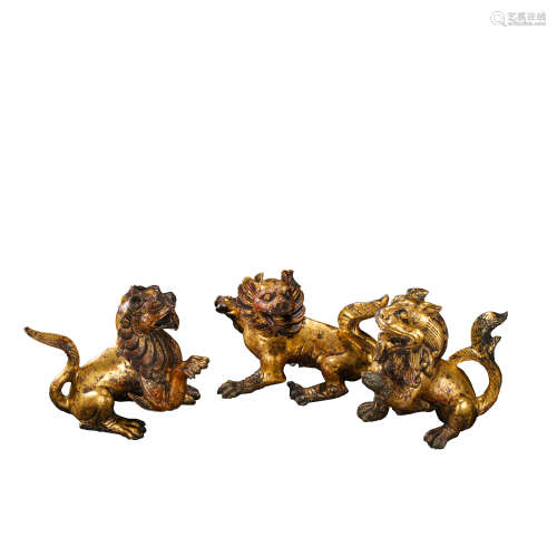 A GROUP OF GILT BRONZE BEASTS FROM THE HAN DYNASTY IN CHINA