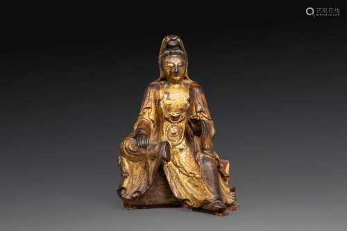 STATUETTE en bois laqué et doré, représentant la déesse Guan...