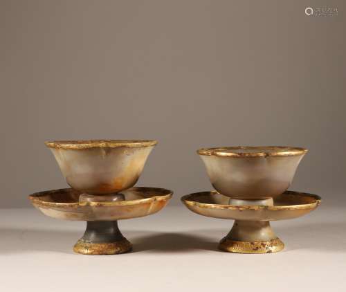A pair of gold coated bowls and plates of agate in Liao Dyna...