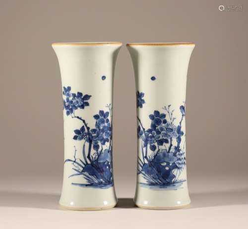 A pair of flower, bird and flower solitary bottles in the Qi...