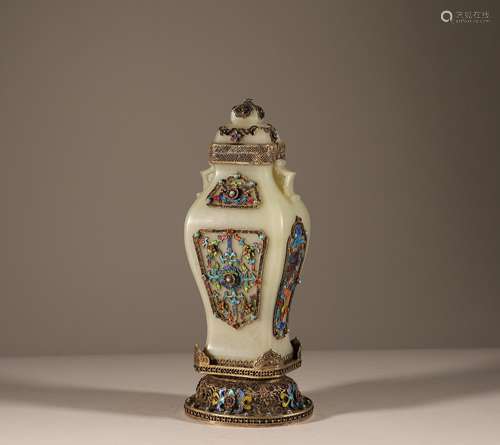 A jade vase with silk cutting and inlaid gems in the Qing Dy...