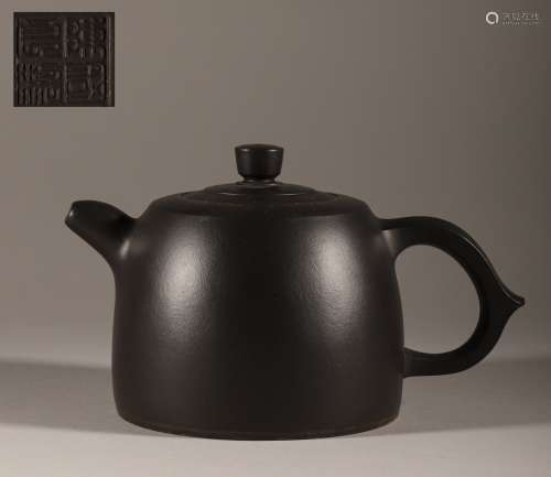 dark-red enameled pottery teapot