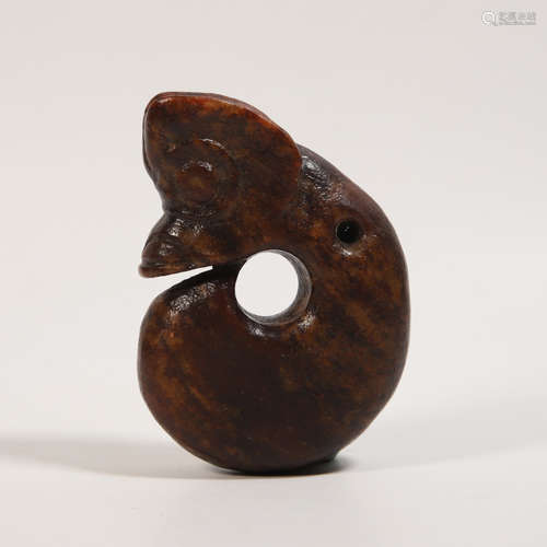 A Carved Brownish Jade Dragon Pendant