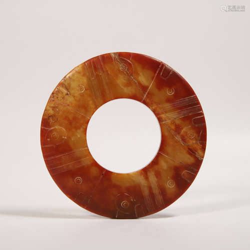 A Carved Russet Jade Disc Bi