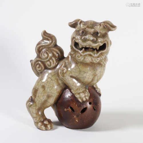 A Carved Porcelain Lion Ornament