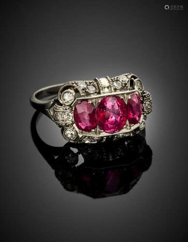 Platinum three oval ruby ring finished with small diamonds, ...