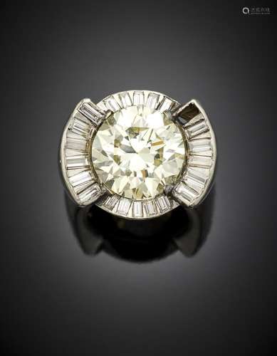 Platinum ring with baguette diamonds encircling a ct. 8.13 r...