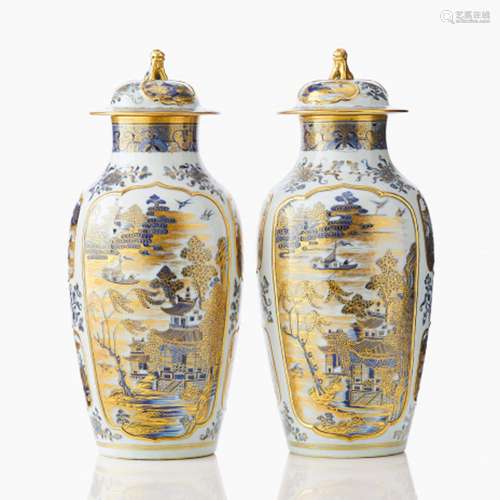 A Pair of Gilt and Blue Vases and Covers