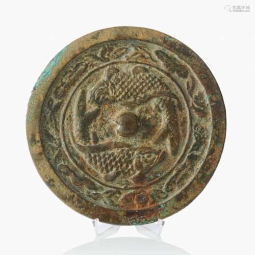 A Chinese Early Bronze Huai Mirror