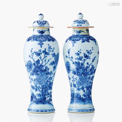 A Pair of Chinese Blue and White Vases and Covers