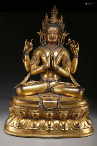 A Gilt Copper Four-Arm Avalokitesvara Statue.