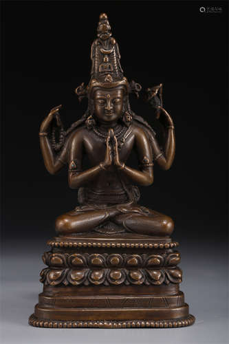 A Copper Four-Arm Avalokitesvara Statue.