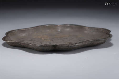 A Silver Plate with Flower Shaped Rim.