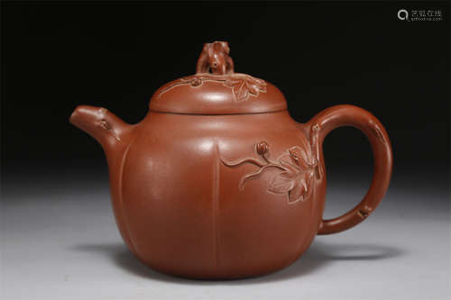 A Ridged Melon Shaped Purple Clay Teapot.