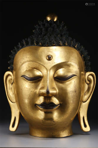A Gilt Copper Buddha's Head Sculpture.