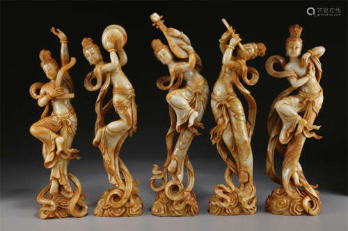 A Group of Antique Jade Apsaras Statues.