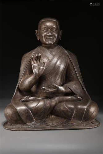 A Silver Guru Buddha Statue.