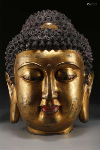 A Gilt Copper Buddha's Head Sculpture.