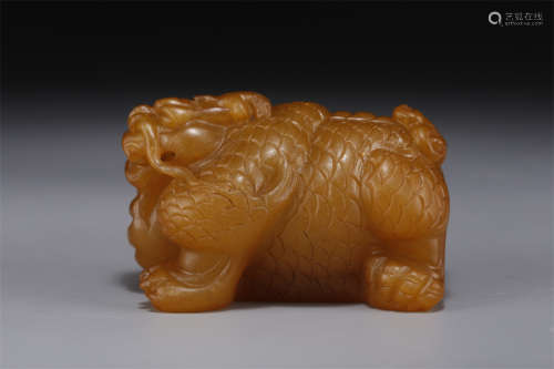 A Field Yellow Stone Beast Carving Ornament.