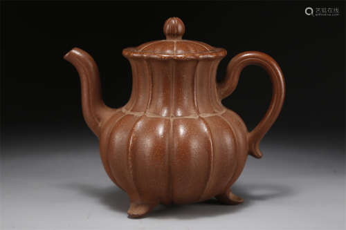 A Tripod Purple Clay Teapot.