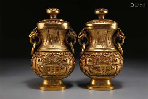 A Set of Gilt Copper Lidded Bottles.