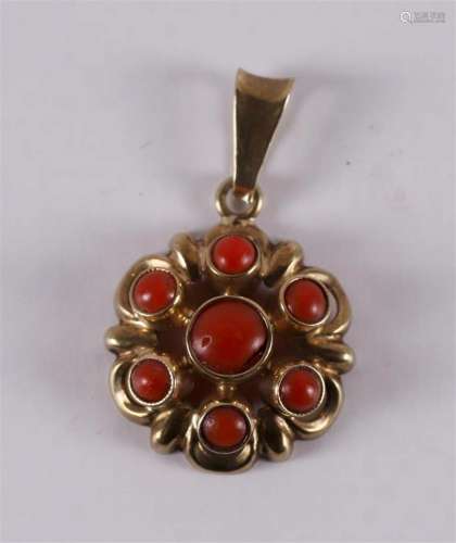 An 8 carat BWG pendant with cabochon cut red corals.