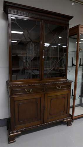 A two-door display cabinet, England, mid 19th century.