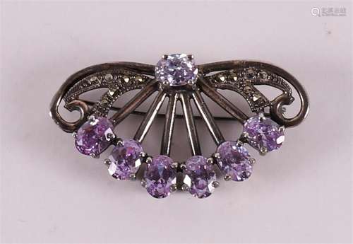 A first grade silver brooch with faceted amethysts and marca...